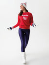 Model in leggings and apres ski sweatshirt