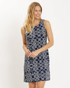 Blonde model wearing navy and white rope print sleeveless dress