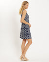 Blonde model wearing navy and white rope print sleeveless dress standing to the side