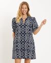 Smiling model in the Jude Connally Emerson Dress - Lattice Ropes Navy