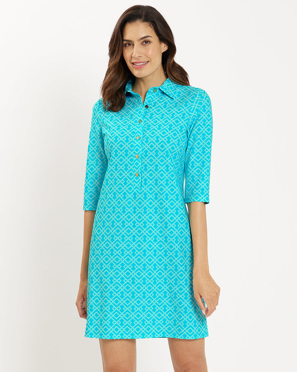 Front view of smiling model in the Jude Connally Susanna Dress - Trellis Trio Aqua