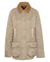 Flat view of the Barbour Beadnell Polarquilt Jacket - Sand Dune. A tan hunting jacket with a corduroy collar and 2 sets of pockets