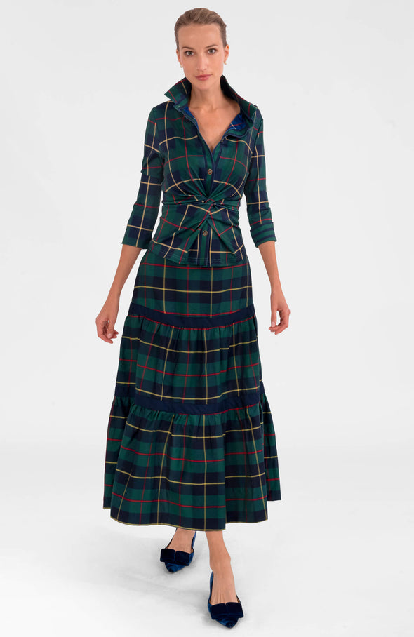 Full body view of the GS Twist and Shout top with a matching green plaid skirt