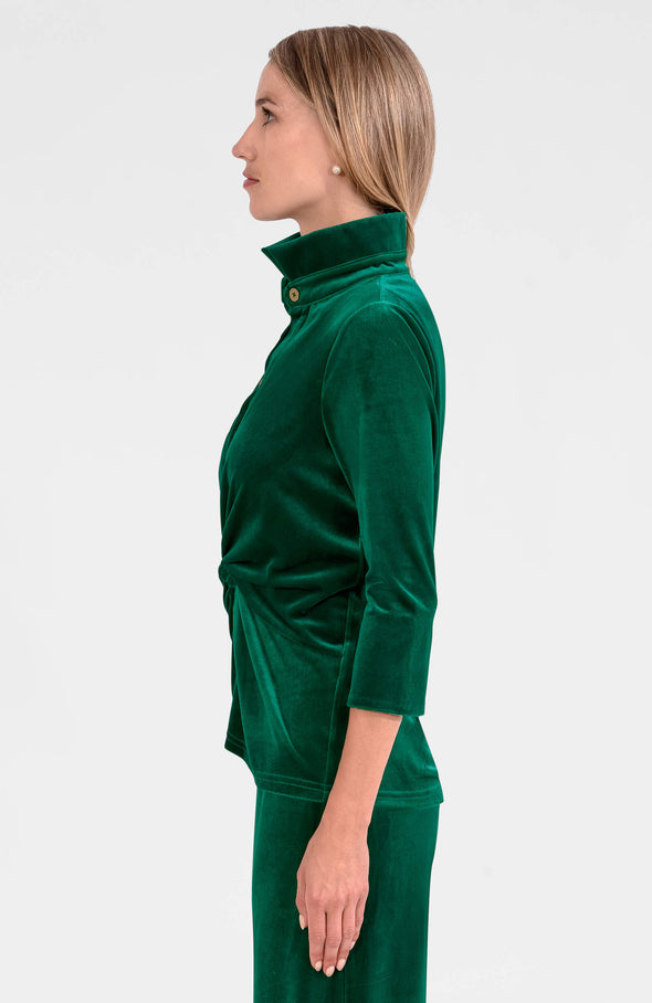 Side view of model in the Gretchen Scott Twist & Shout Top - Silky Velvet - Green