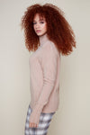 Red headed model in beige Renuar sweater