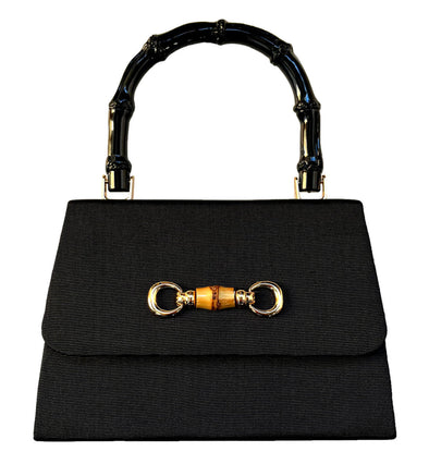 Black faille purse with gold and bamboo snaffle embellishment on the flap and a black bamboo handle